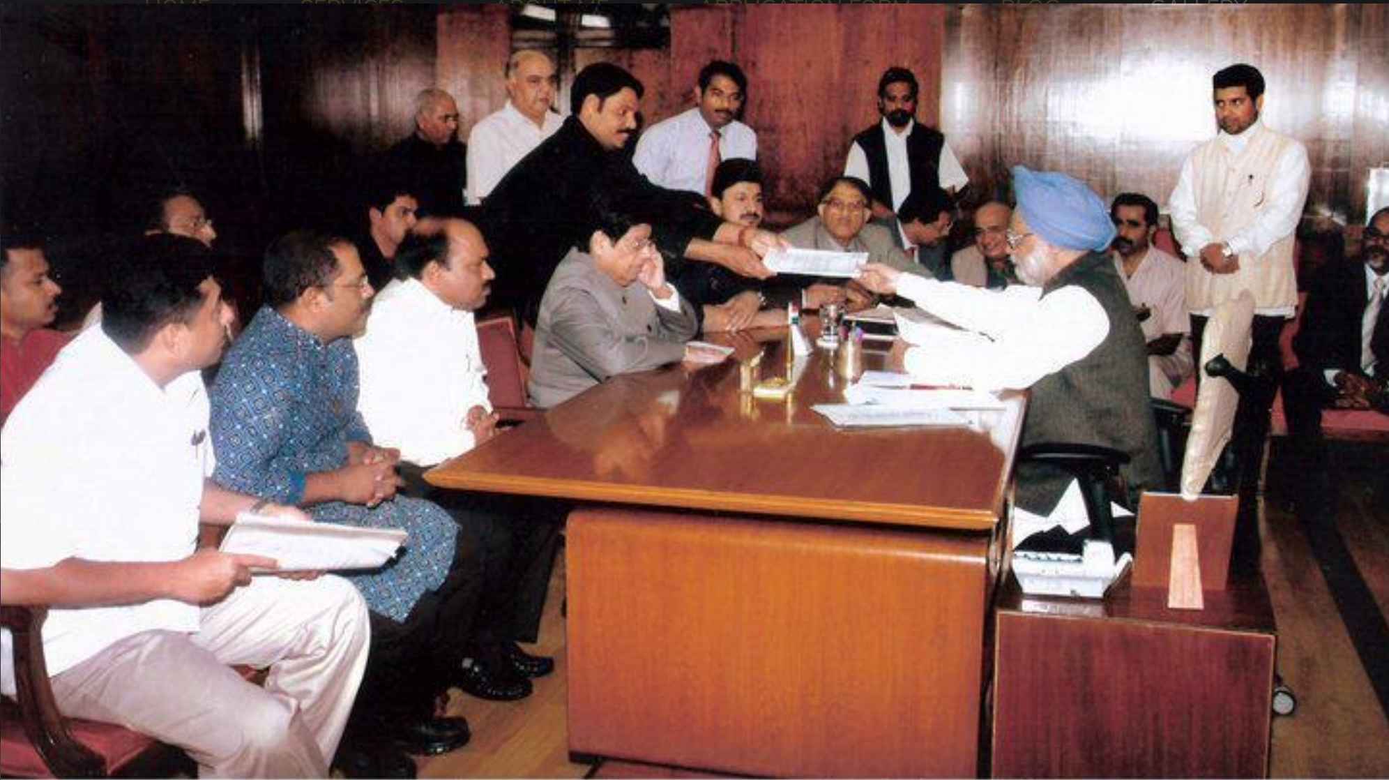 Mr. Salam Pappinessery Delivers a Request Representing the Expats to the Honorable Former Prime Minister of India Dr. Manmohan Singh.